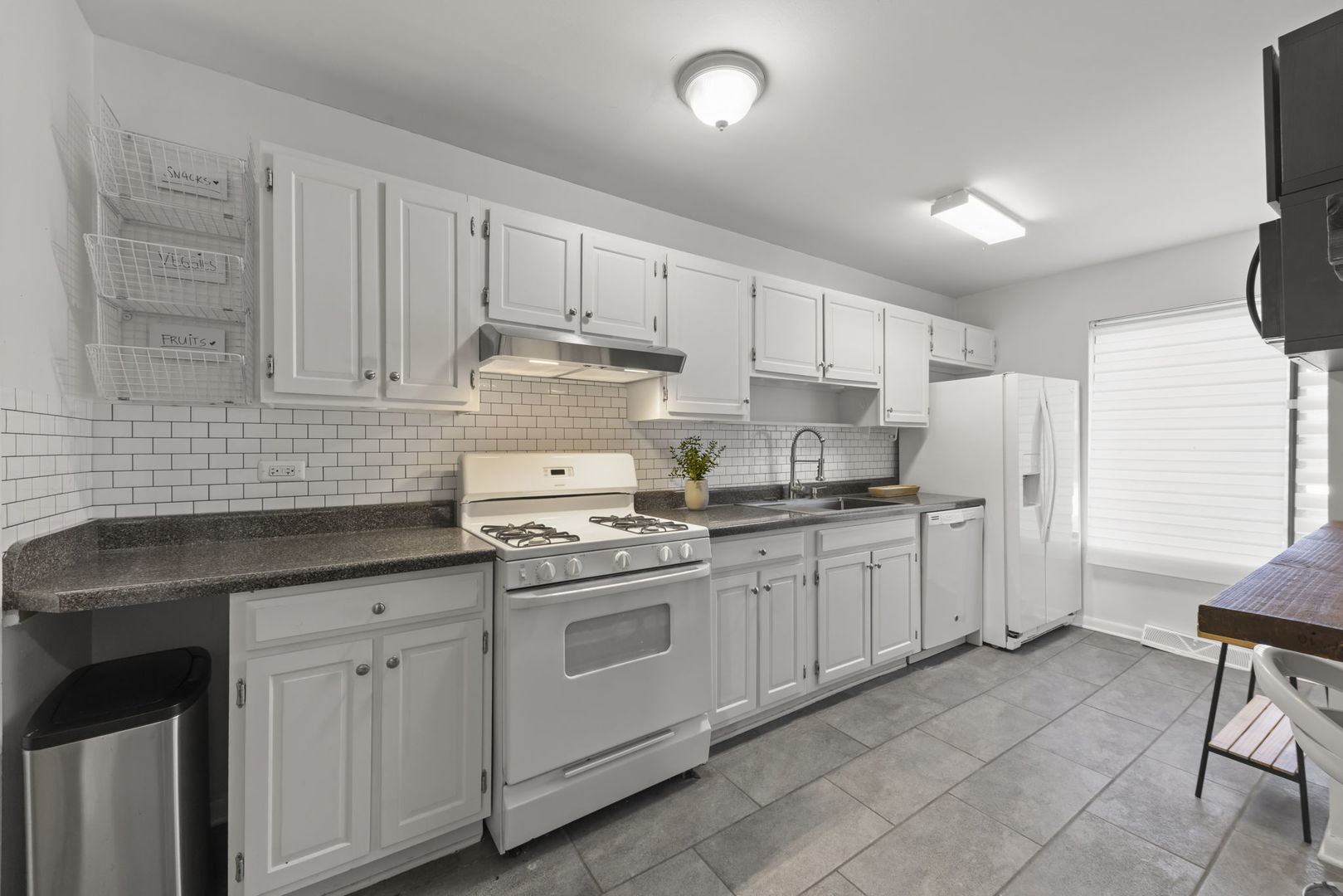 698 Circle Drive Roselle, IL 60172 - Photo 8 of 31 a kitchen with white cabinets and white appliances