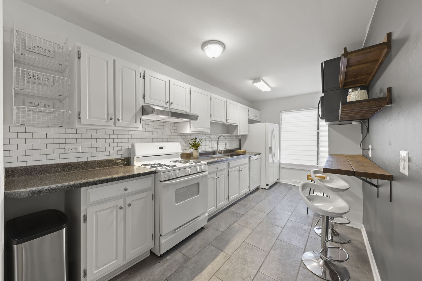 698 Circle Drive Roselle, IL 60172 - Photo 9 of 31 a kitchen with a sink cabinets and window