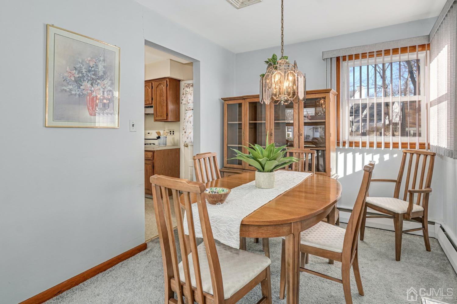 22 Morningside Road Colonia, NJ 07067 - Photo 11 of 31 a view of a dining room with furniture window and outside view