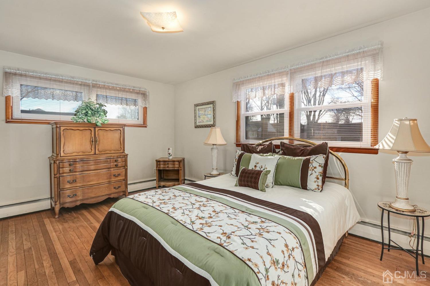 22 Morningside Road Colonia, NJ 07067 - Photo 18 of 31 a bedroom with a bed and wooden floor