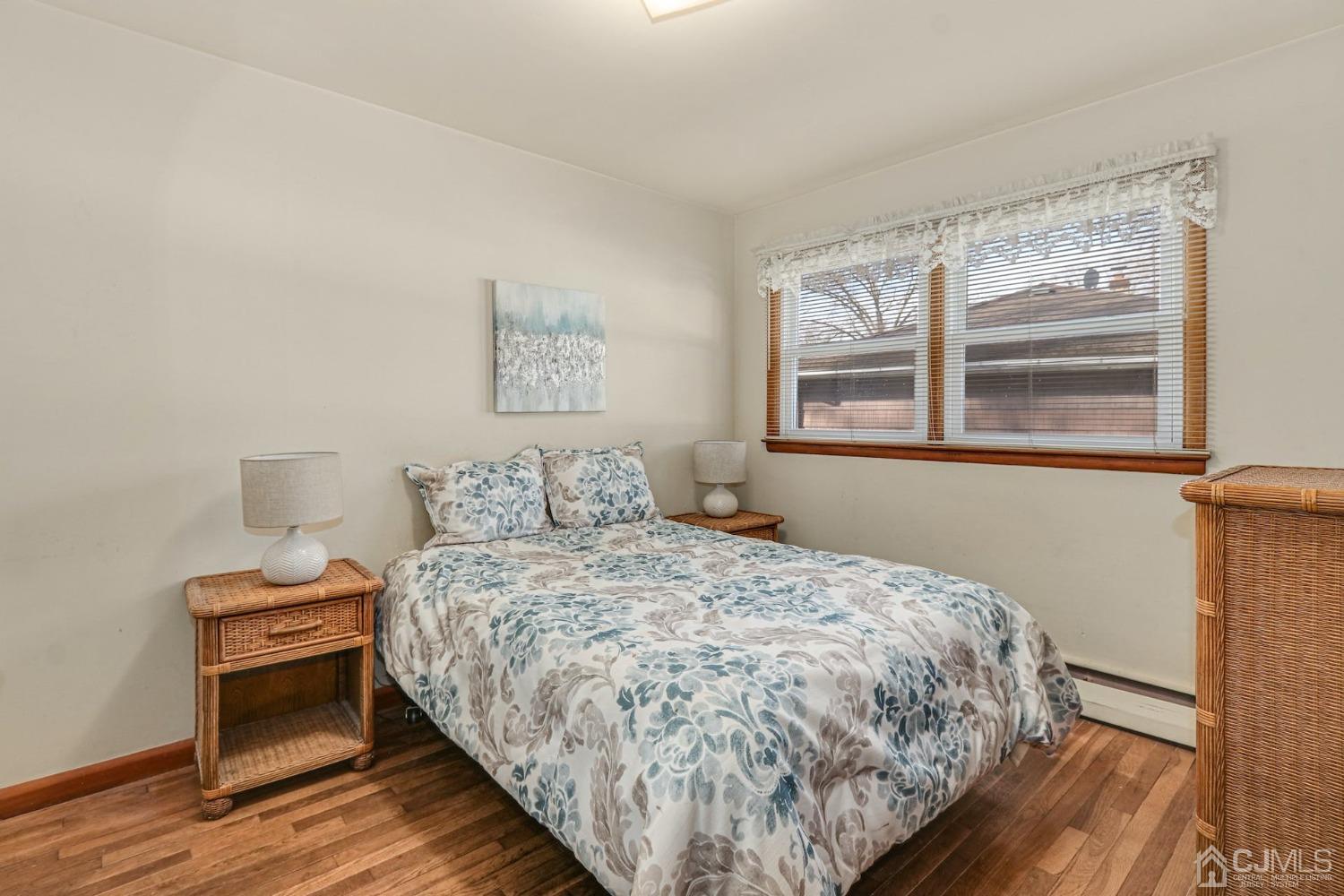 22 Morningside Road Colonia, NJ 07067 - Photo 22 of 31 a bedroom with a bed and wooden floor