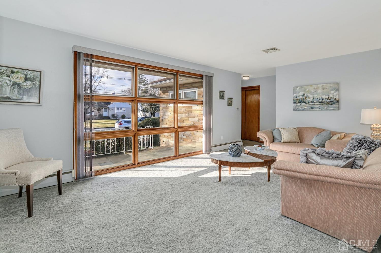 22 Morningside Road Colonia, NJ 07067 - Photo 8 of 31 a living room with furniture and a large window
