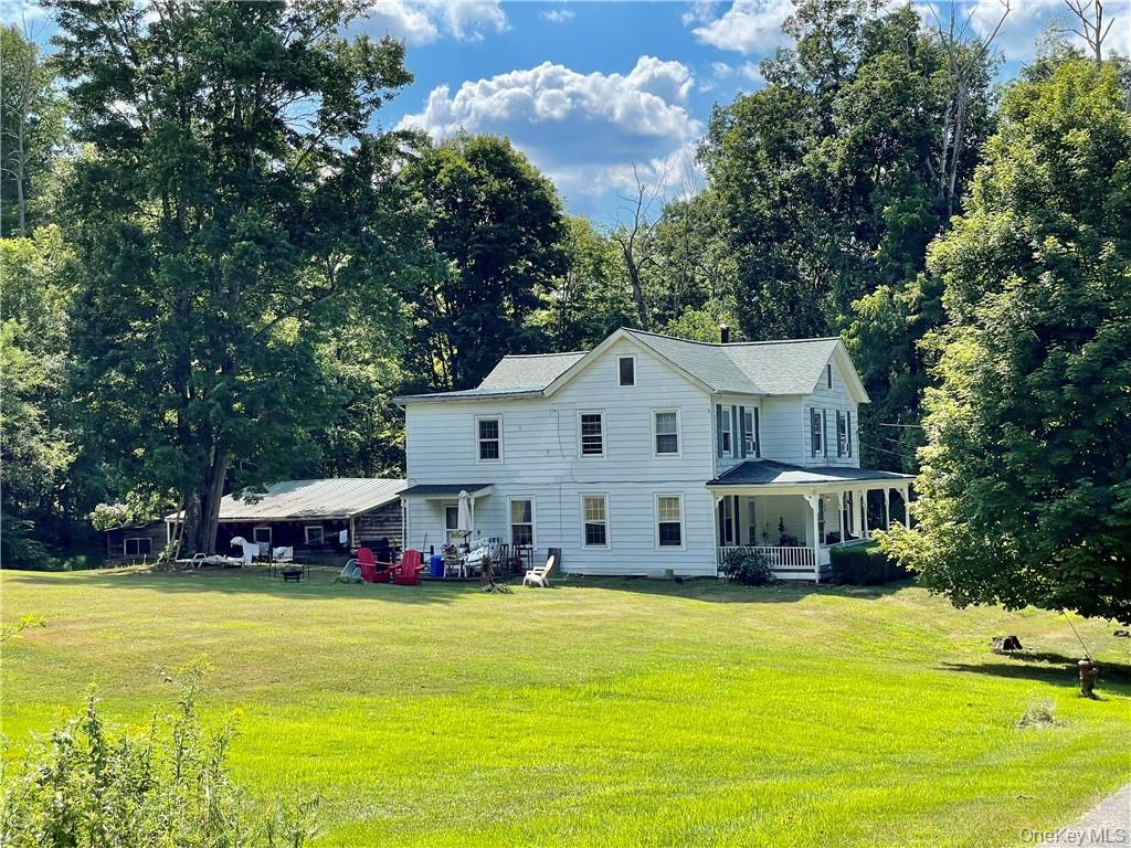 17 Ribbecke Hill Road, Unit 1 Pine Bush, NY 12566 - Photo 2 of 13 a front view of a building with swimming pool and trees