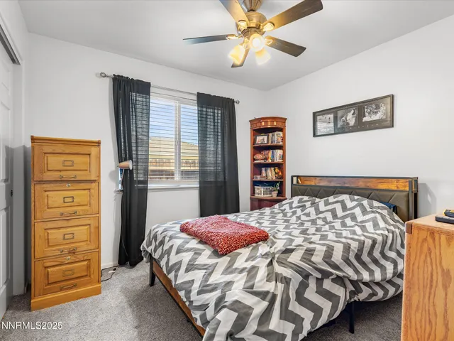 a bedroom with a bed and a closet