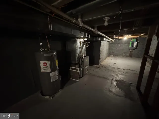 a room with water heater and a wooden table