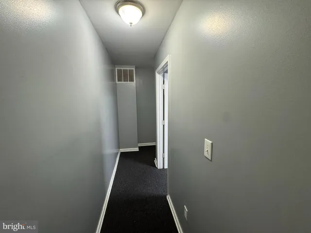 a view of a hallway view with staircase