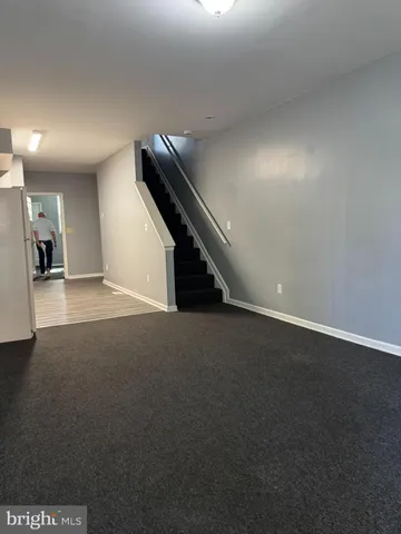 a kitchen with a refrigerator a stove top oven a sink and dishwasher