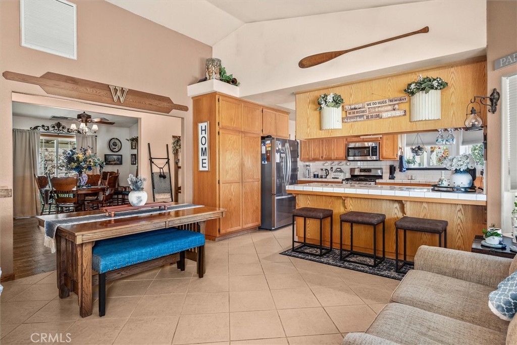 46455 Konklin Road Coarsegold, CA 93614 - Photo 13 of 46 a room with stainless steel appliances kitchen island granite countertop furniture and a kitchen view