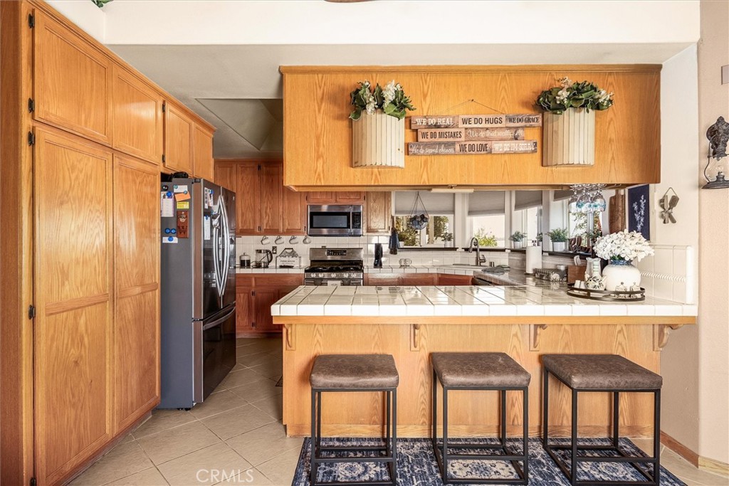 46455 Konklin Road Coarsegold, CA 93614 - Photo 14 of 46 a kitchen with a sink and cabinets