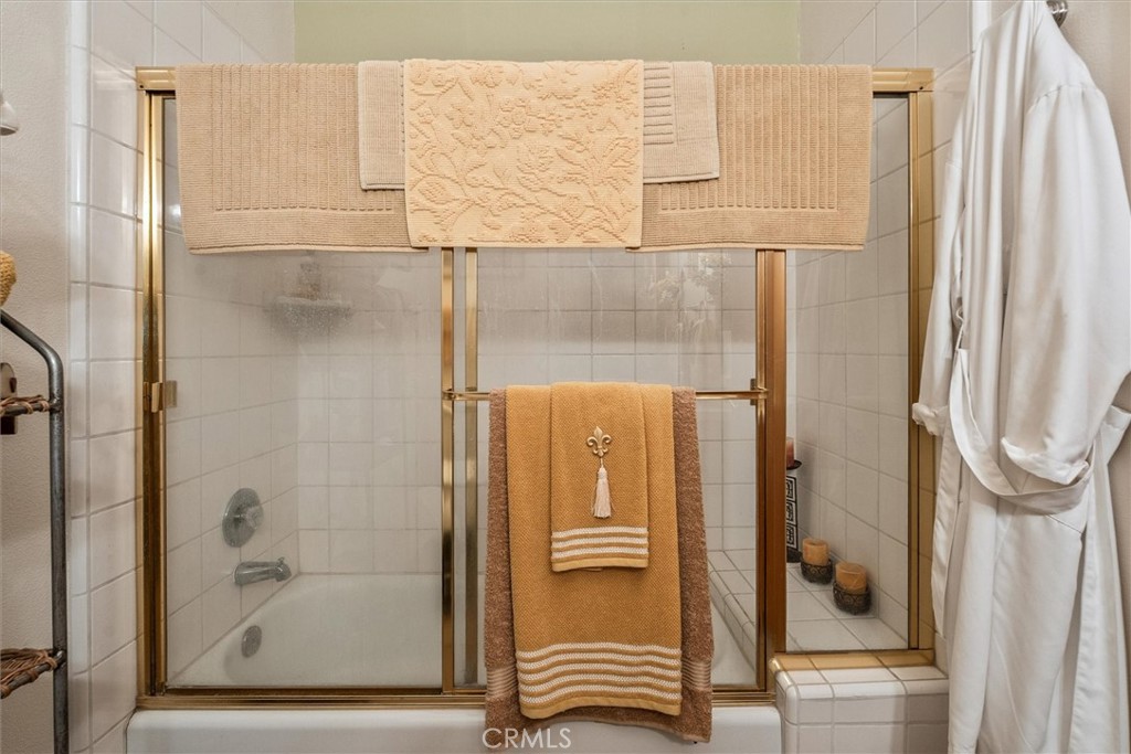 46455 Konklin Road Coarsegold, CA 93614 - Photo 25 of 46 a bathroom with a shower and a mirror
