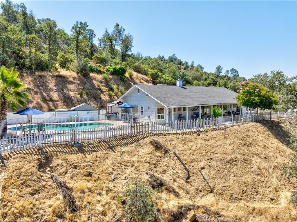 46455 Konklin Road Coarsegold, CA 93614 - Photo 3 of 46 a house with trees in the background
