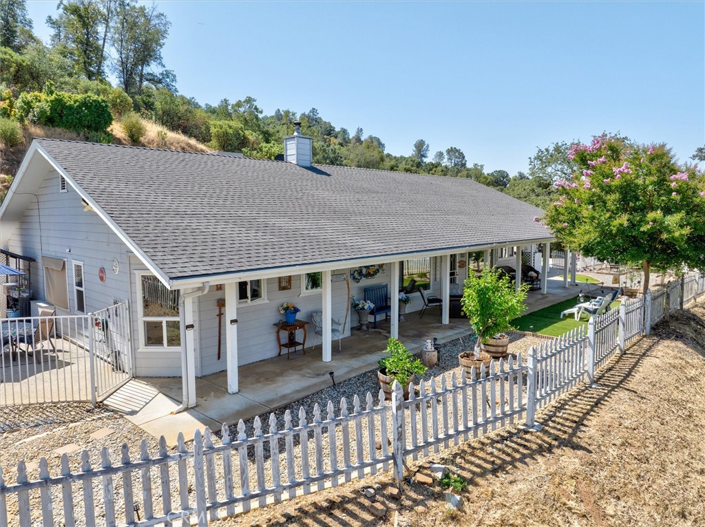46455 Konklin Road Coarsegold, CA 93614 - Photo 32 of 46 a view of a house with a small yard and plants