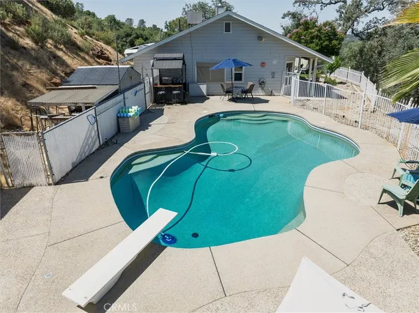a view of a swimming pool with a patio