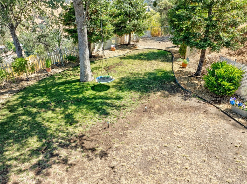 46455 Konklin Road Coarsegold, CA 93614 - Photo 38 of 46 a view of a yard with plants and large trees