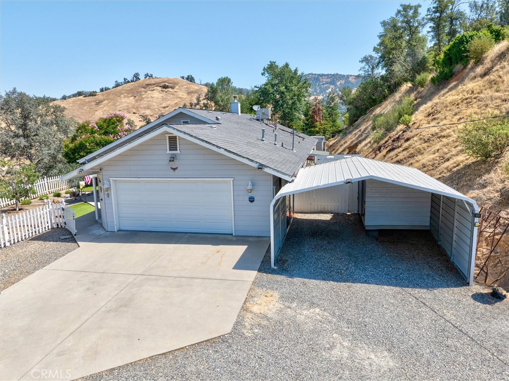 46455 Konklin Road Coarsegold, CA 93614 - Photo 4 of 46 a view of a house with a yard and garage