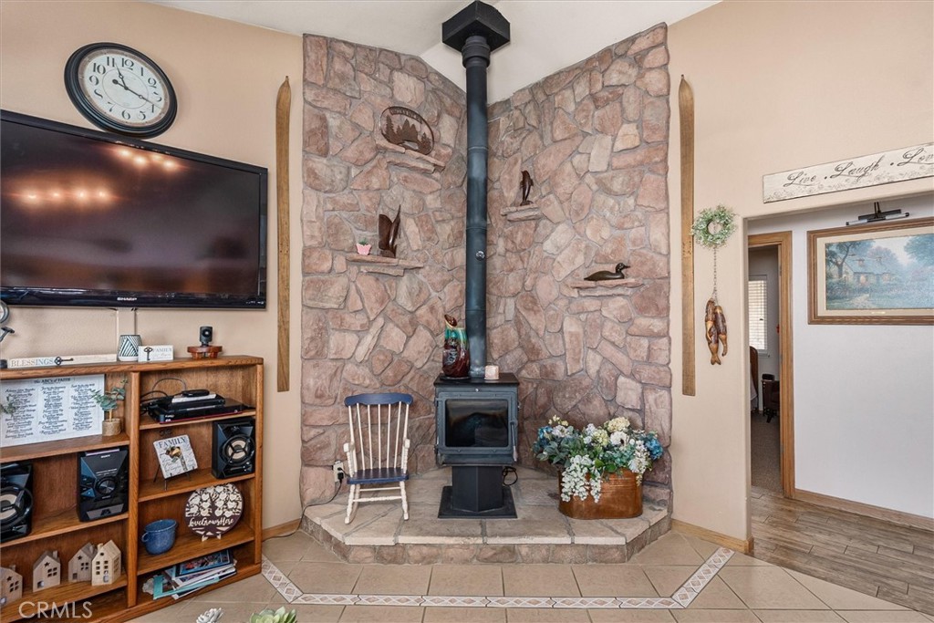 46455 Konklin Road Coarsegold, CA 93614 - Photo 9 of 46 a living room with fireplace furniture and a flat screen tv