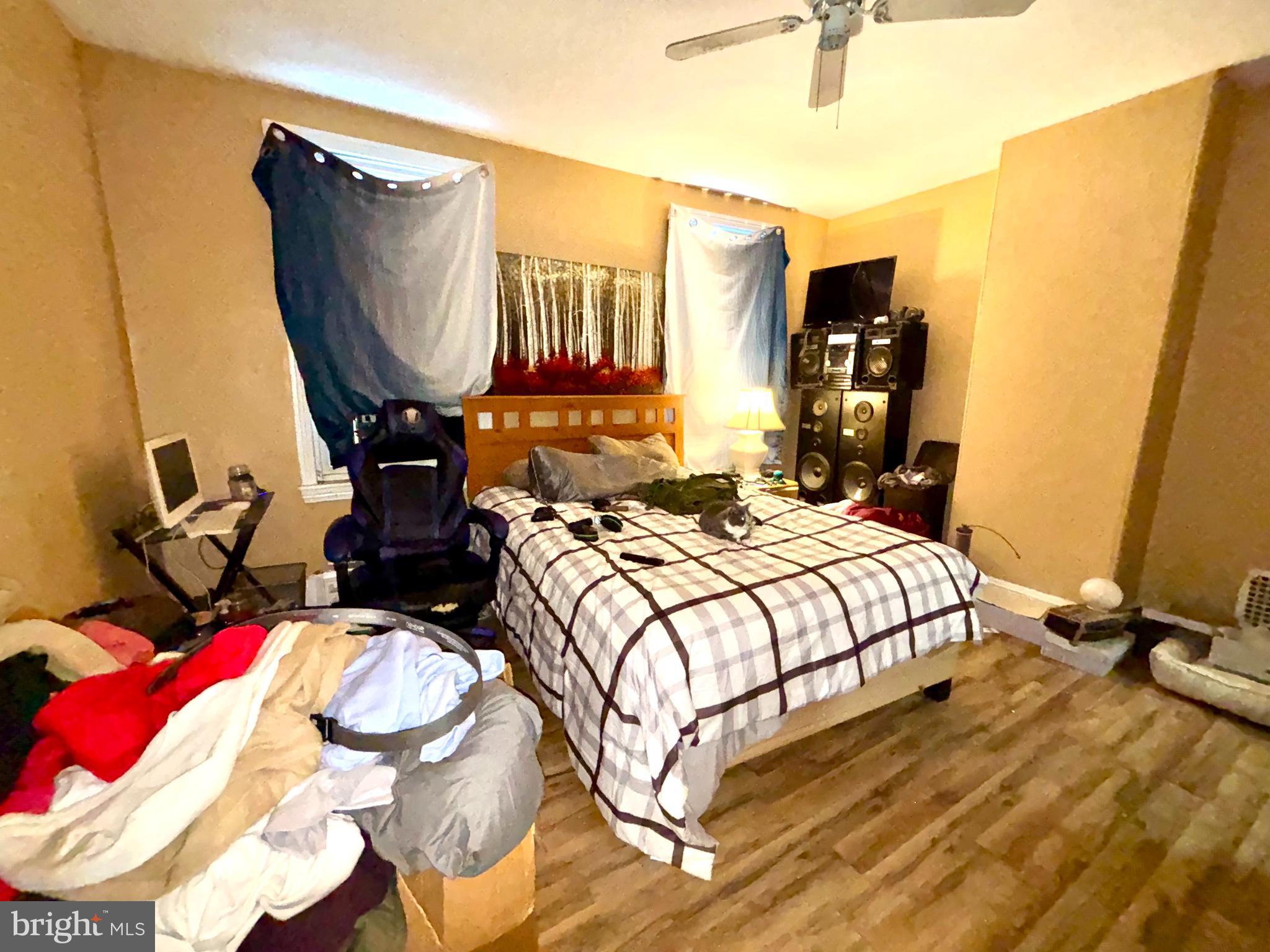 5144 West Stiles Street Philadelphia, PA 19131 - Photo 13 of 16 a bedroom with bed and a mirror