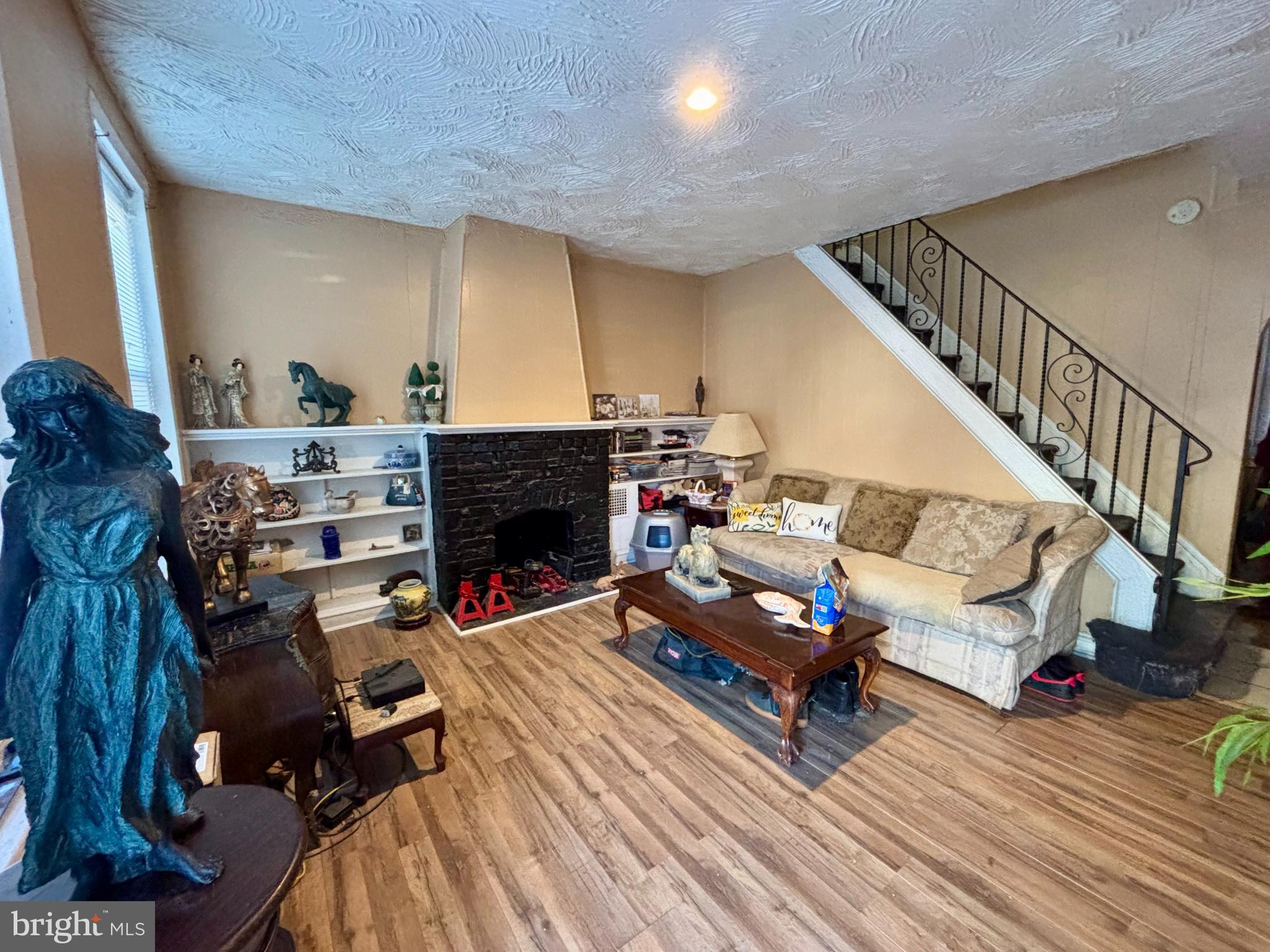 5144 West Stiles Street Philadelphia, PA 19131 - Photo 2 of 16 a living room with furniture and a fireplace