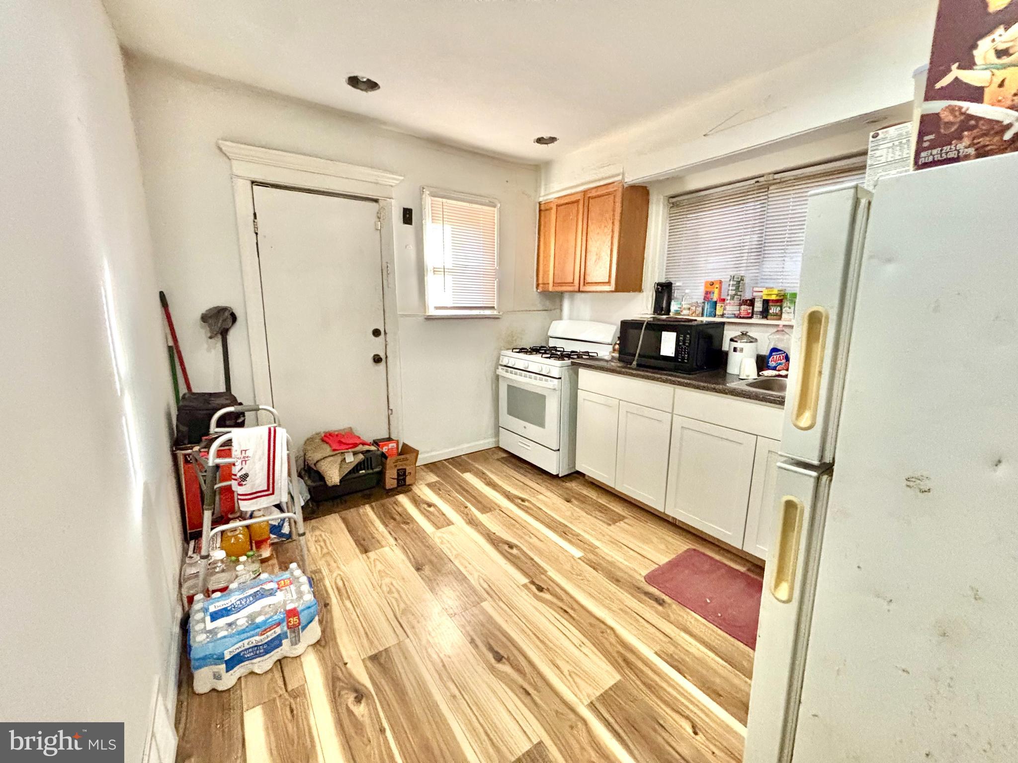 5144 West Stiles Street Philadelphia, PA 19131 - Photo 5 of 16 a kitchen with a sink appliances and cabinets