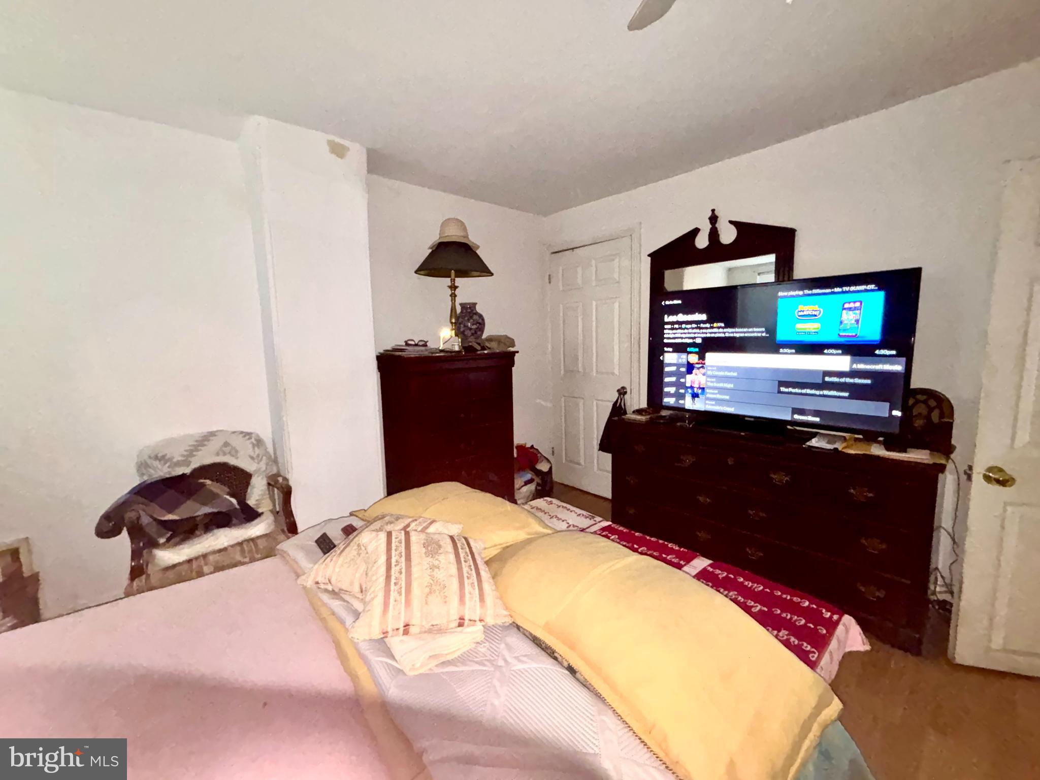 5144 West Stiles Street Philadelphia, PA 19131 - Photo 8 of 16 a bedroom with a bed and a flat screen tv