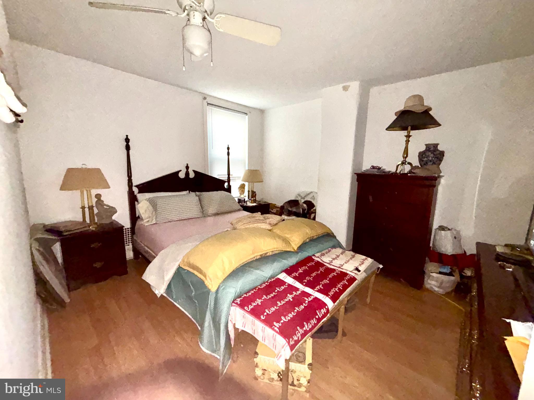 5144 West Stiles Street Philadelphia, PA 19131 - Photo 9 of 16 a bedroom with a bed and wooden floor