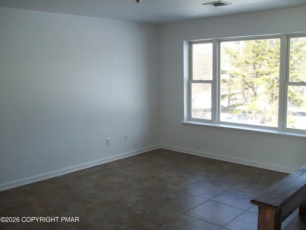 a kitchen with stainless steel appliances granite countertop a stove a microwave and a refrigerator