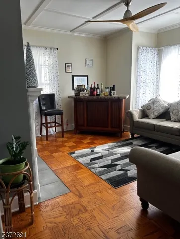 a living room with furniture rug and window