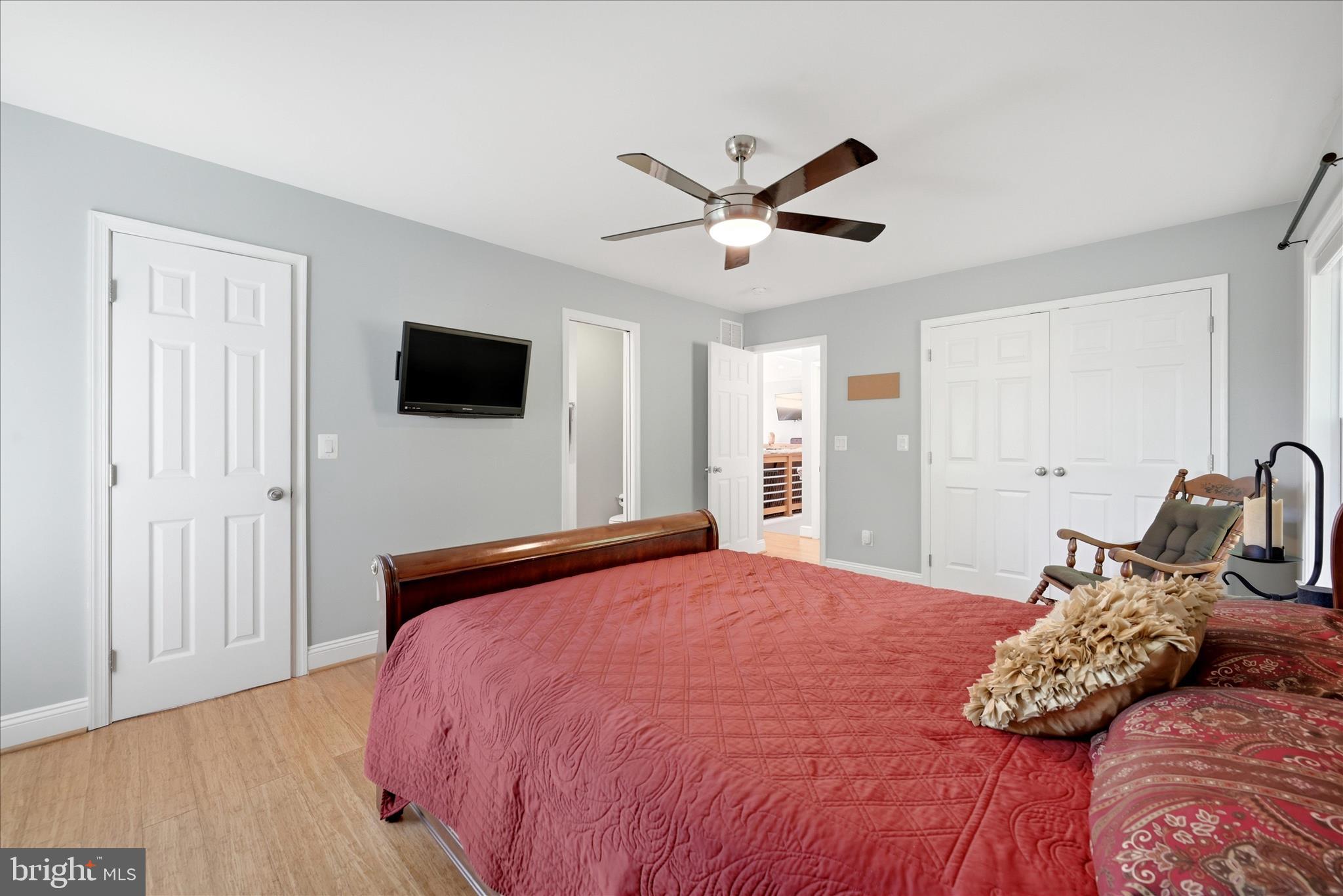 500 Delicious Road Linden, VA 22642 - Photo 19 of 80 a bedroom with a large bed and a flat screen tv