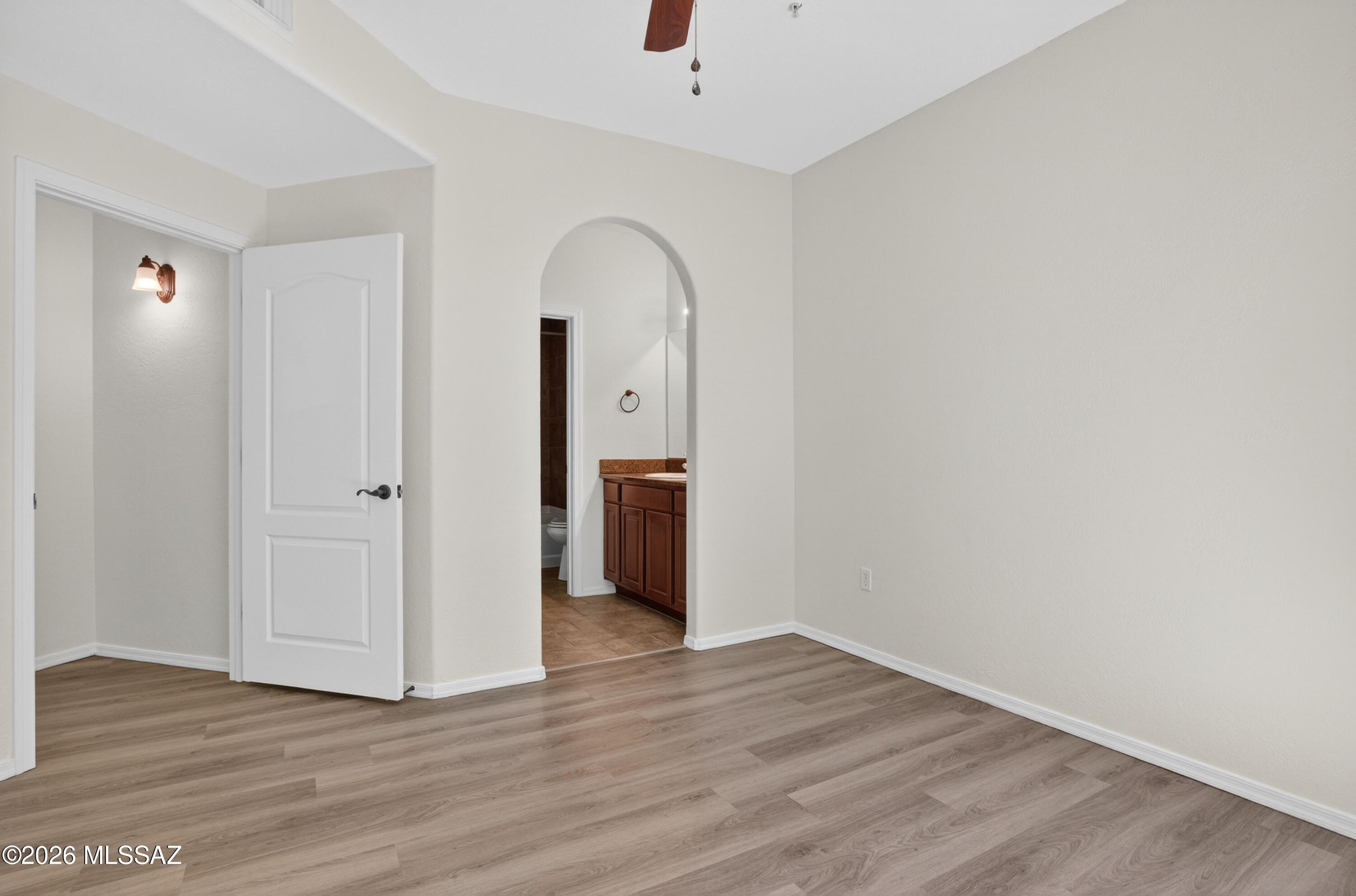 2550 East River Road, Unit 4204 Tucson, AZ 85718 - Photo 17 of 36 a view of empty room with wooden floor