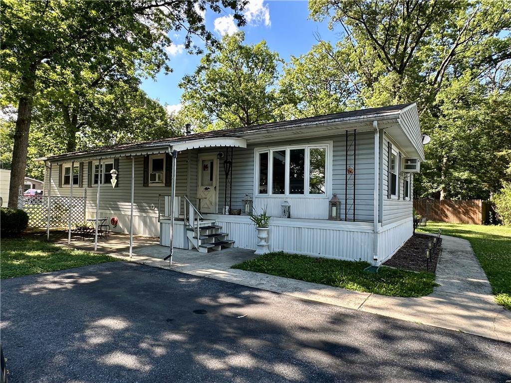 381 Red Oak Lane Bath, PA 18014 - Photo 2 of 27 A welcoming front entrance, surrounded by mature trees, provides a peaceful retreat.