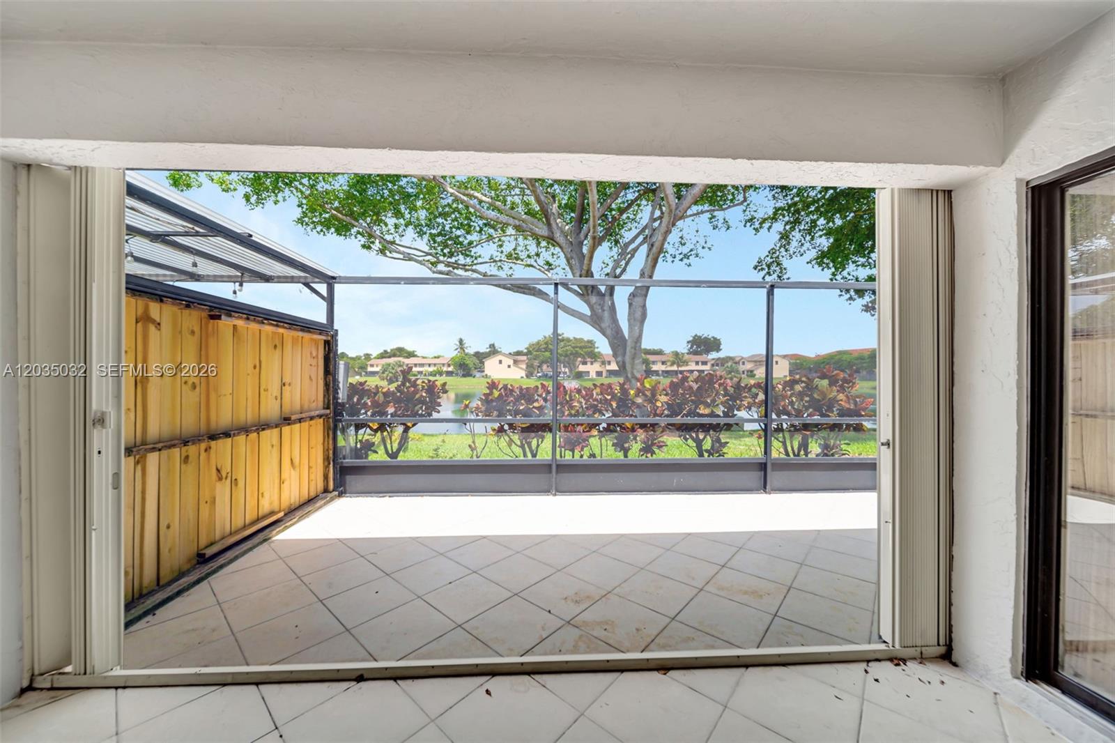 5223 Gate Lake Road, Unit 5223 Tamarac, FL 33319 - Photo 27 of 37 a view of a large window with an outdoor space