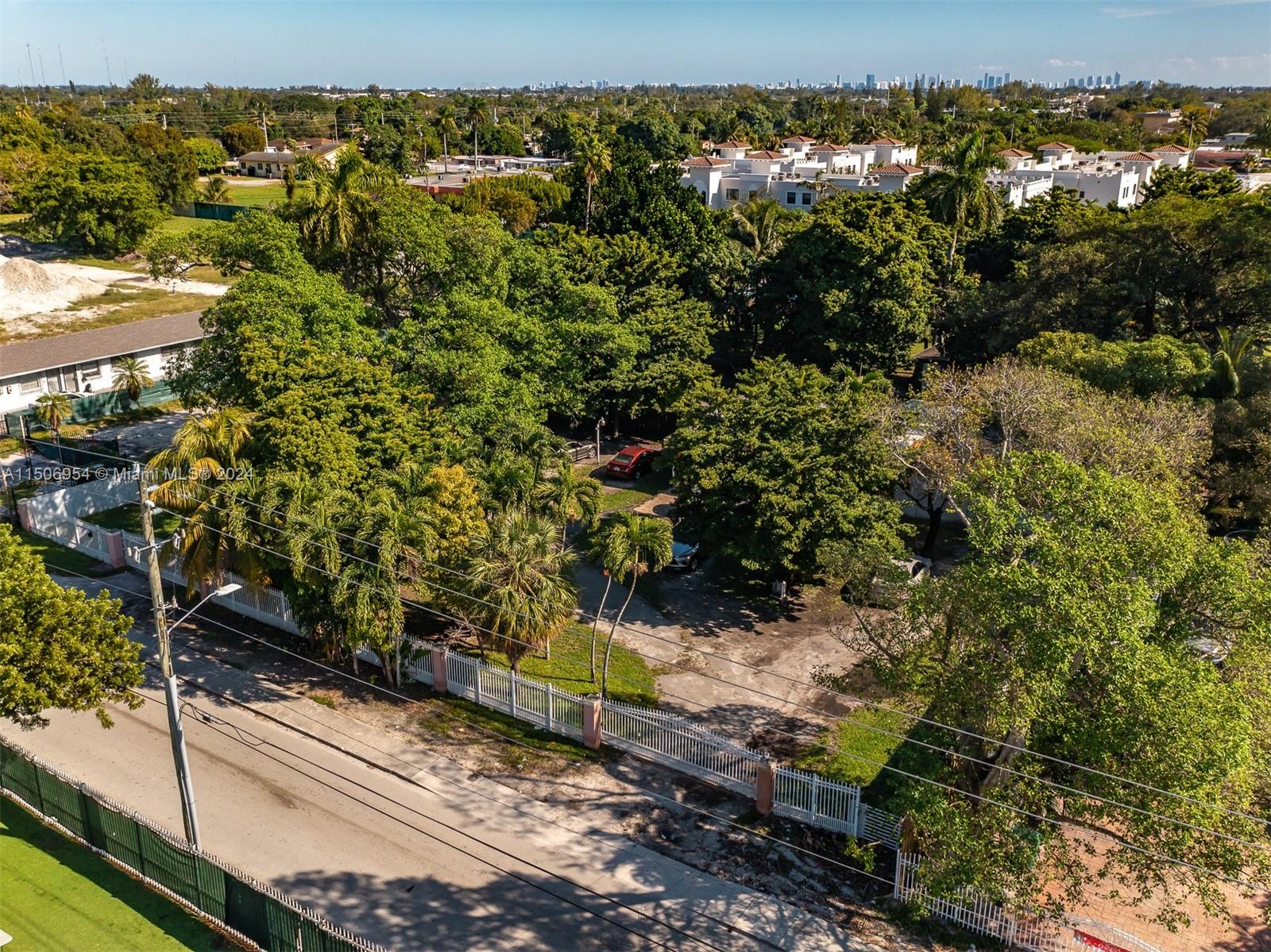 13265 Alexandria Drive Opa-Locka, FL 33054 - Photo 5 of 11 a view of a yard with wooden fence