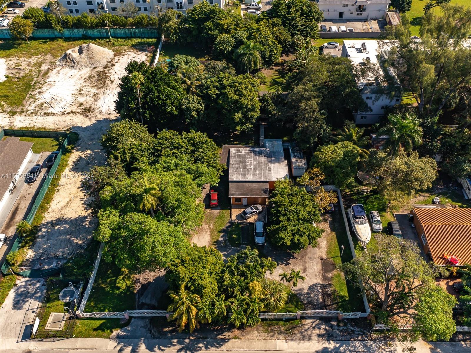 13265 Alexandria Drive Opa-Locka, FL 33054 - Photo 6 of 11 an aerial view of residential house with outdoor space and lake view