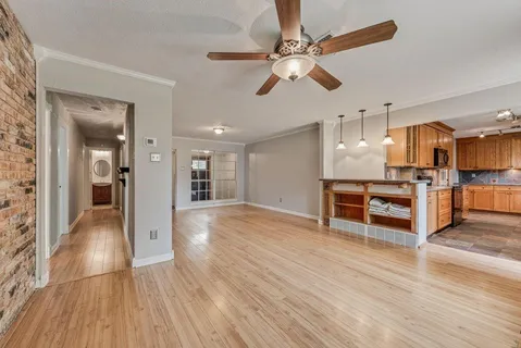a view of kitchen with furniture and wooden floor