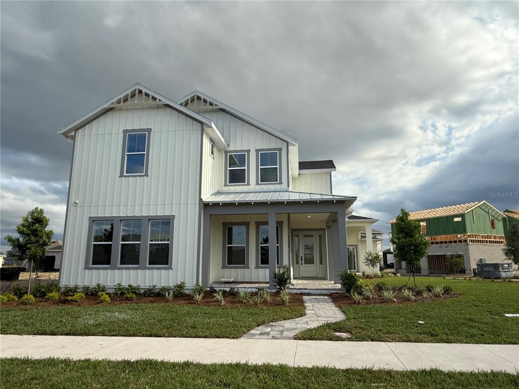 9828 Peebles Street Orlando, FL 32827 - Photo 1 of 1 a front view of a house with a yard