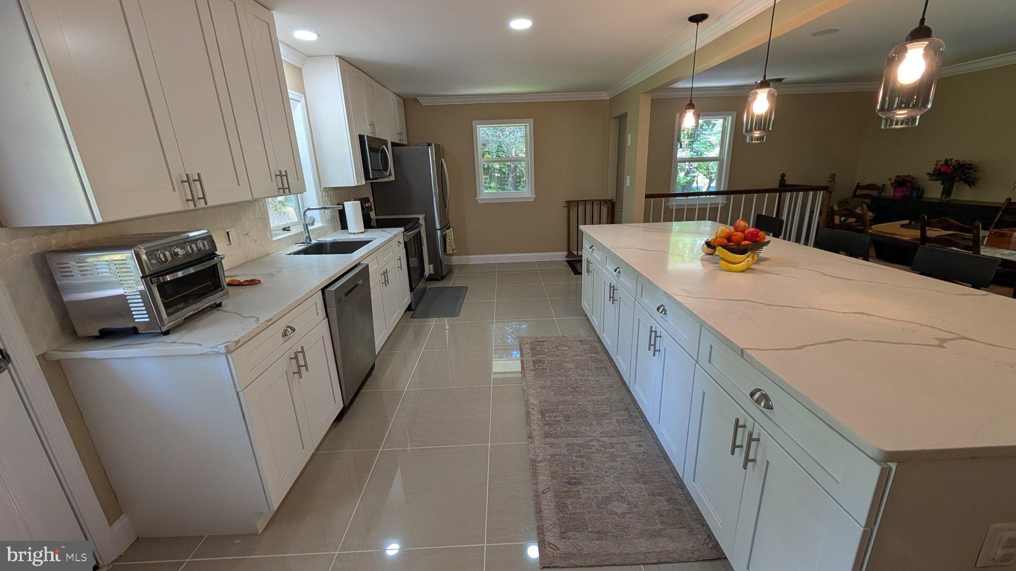 15715 Tierra Drive Silver Spring, MD 20906 - Photo 11 of 40 Modern kitchen with sleek finishes.