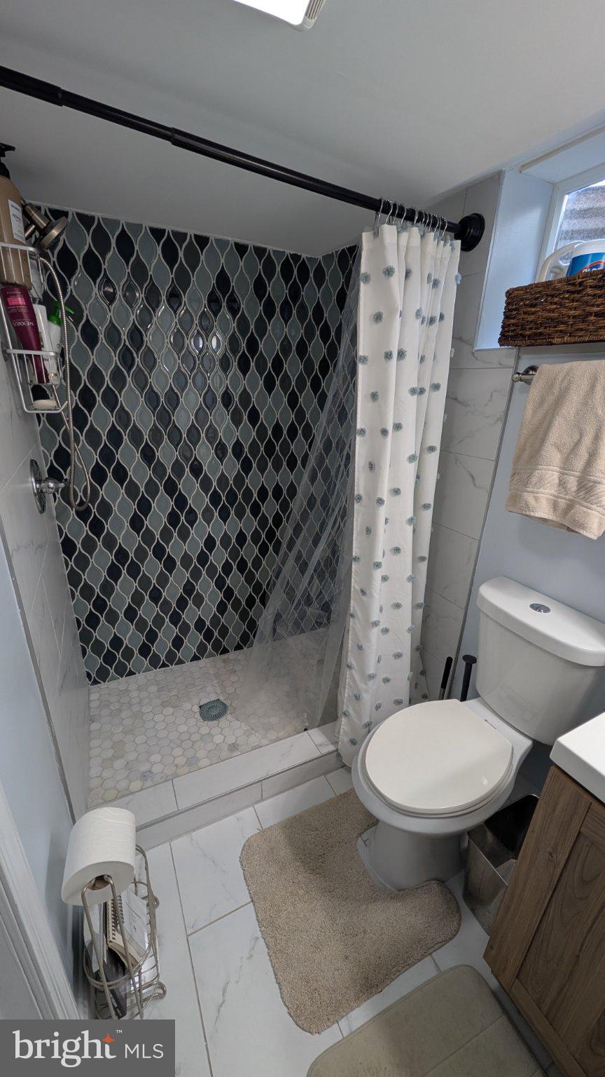 15715 Tierra Drive Silver Spring, MD 20906 - Photo 33 of 40 Stylish shower with modern tiles.