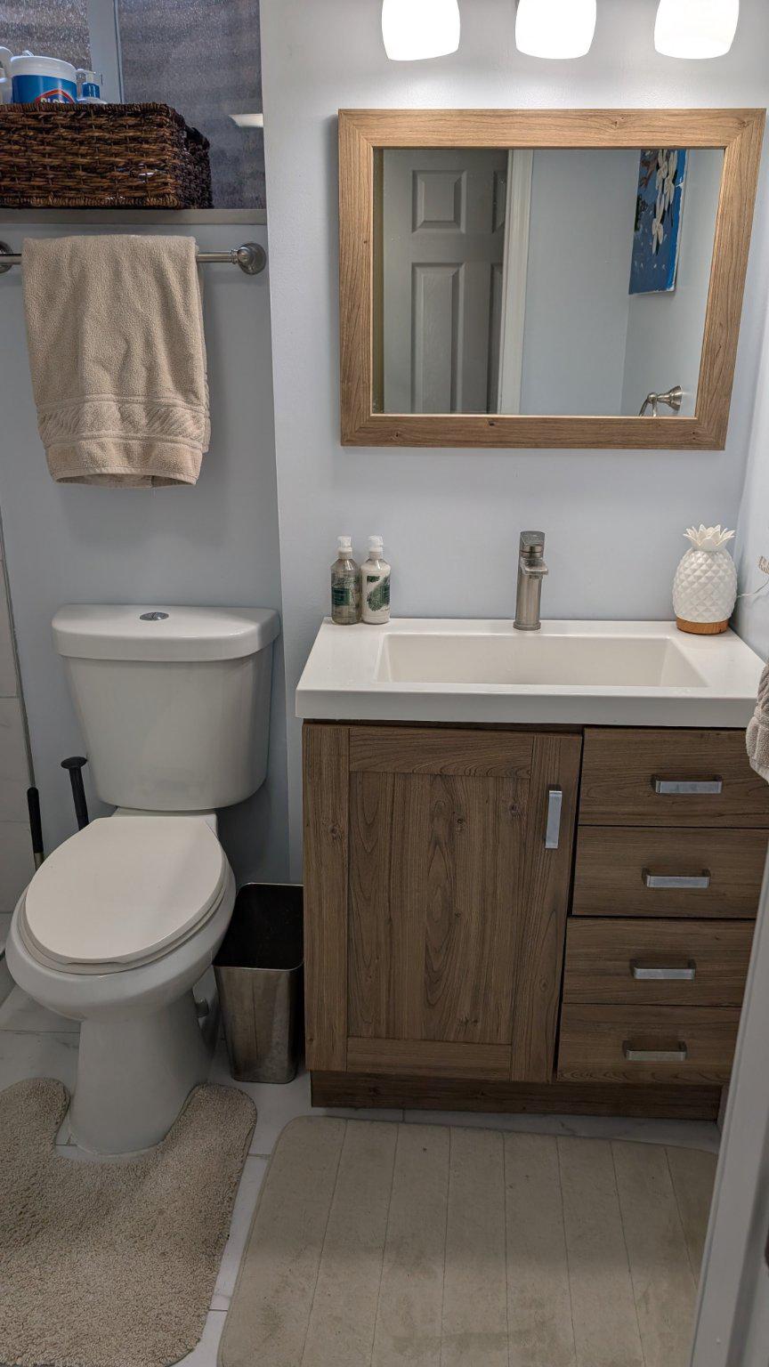15715 Tierra Drive Silver Spring, MD 20906 - Photo 34 of 40 Modern lower level bathroom with sleek finishes.