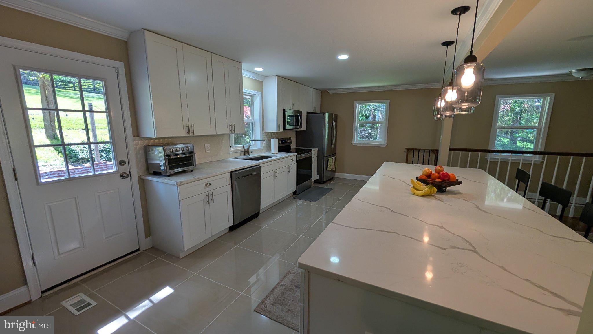 15715 Tierra Drive Silver Spring, MD 20906 - Photo 10 of 40 Modern kitchen with natural light.