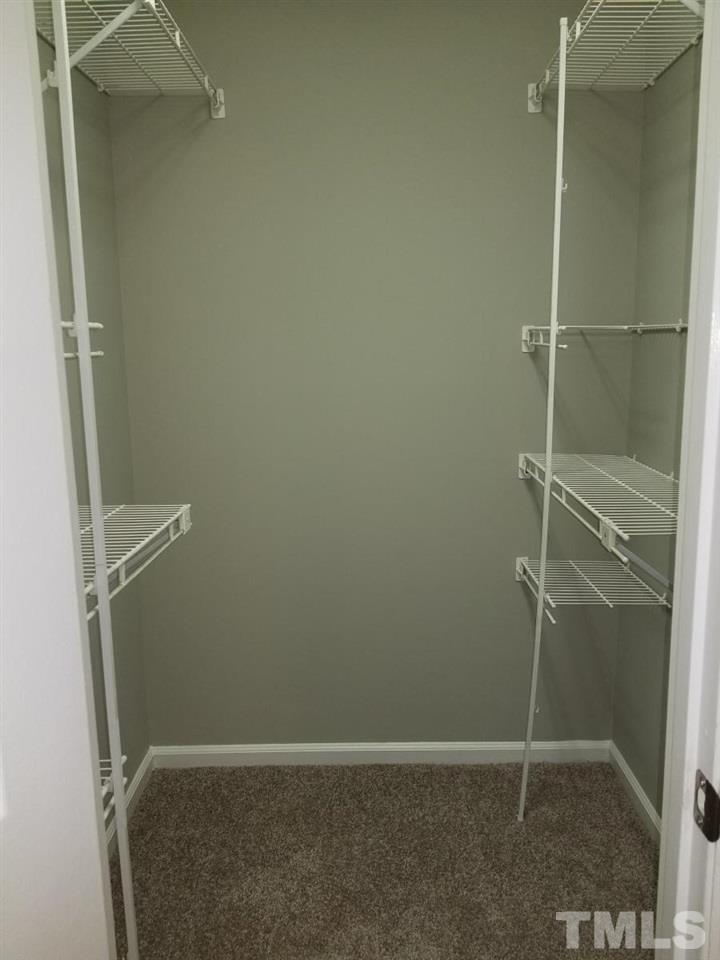 727 Benchmark Drive Raleigh, NC 27615 - Photo 16 of 22 Both Large Bedrooms have walk in closets with built in shelving!