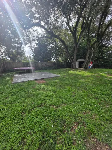 a view of a garden and basketball court