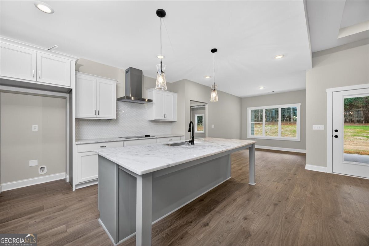 98 Mud Bridge Road The Rock, GA 30285 - Photo 11 of 47 a kitchen with a sink stove and wooden floor