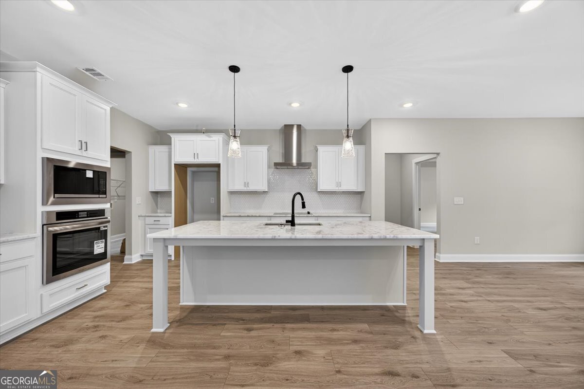 98 Mud Bridge Road The Rock, GA 30285 - Photo 14 of 47 a view of kitchen with sink microwave and refrigerator