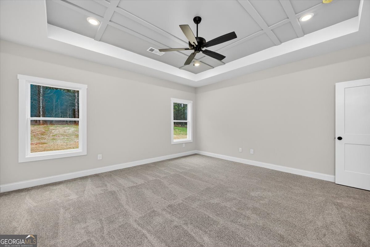 98 Mud Bridge Road The Rock, GA 30285 - Photo 16 of 47 an empty room with a window and a fan