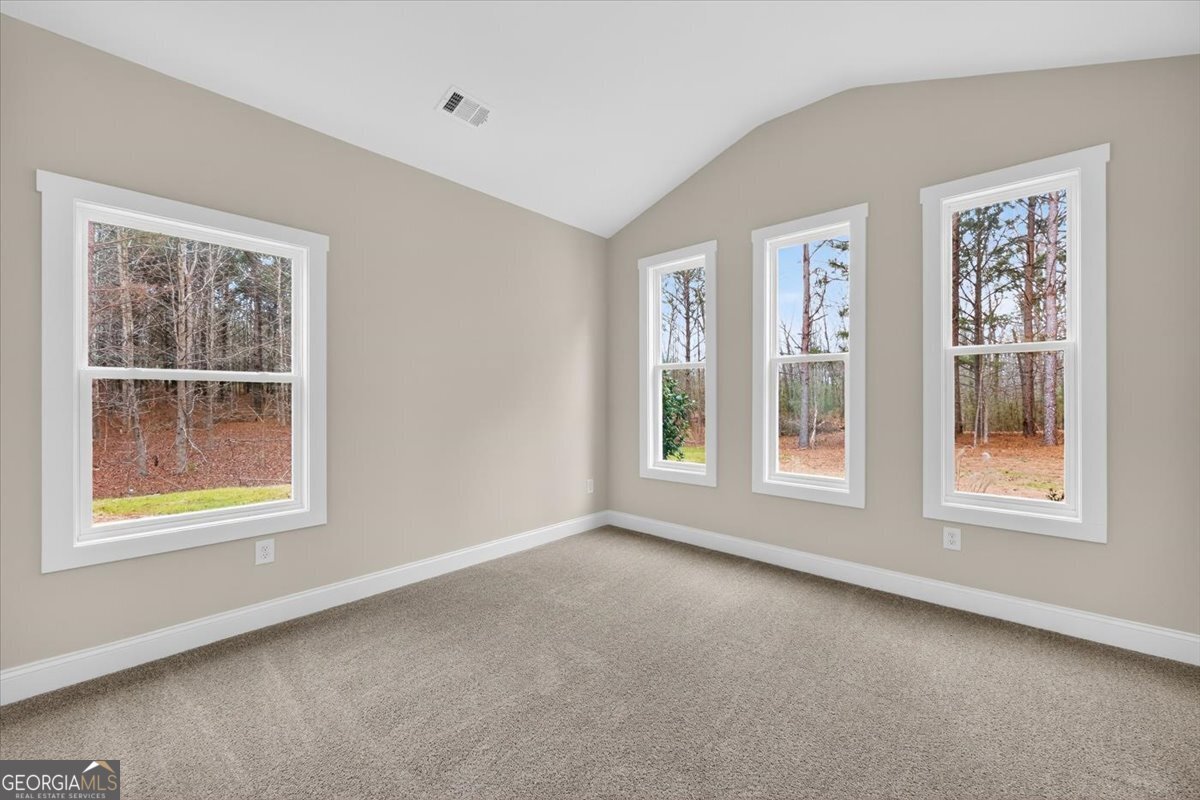 98 Mud Bridge Road The Rock, GA 30285 - Photo 21 of 47 a view of an empty room with a window