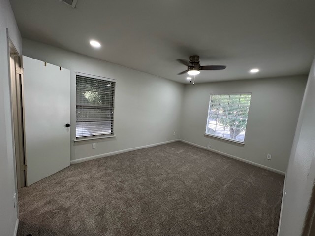 3511 Alpine Circle, Unit 2 Austin, TX 78704 - Photo 1 of 16 en empty room with windows and ceiling fan