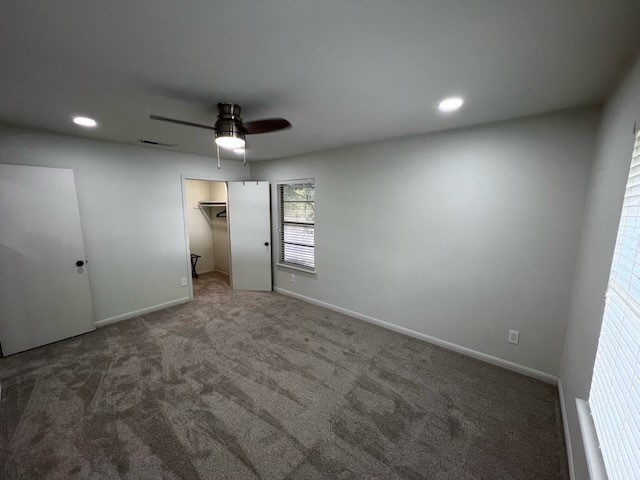 3511 Alpine Circle, Unit 2 Austin, TX 78704 - Photo 15 of 16 an empty room with windows and ceiling fan