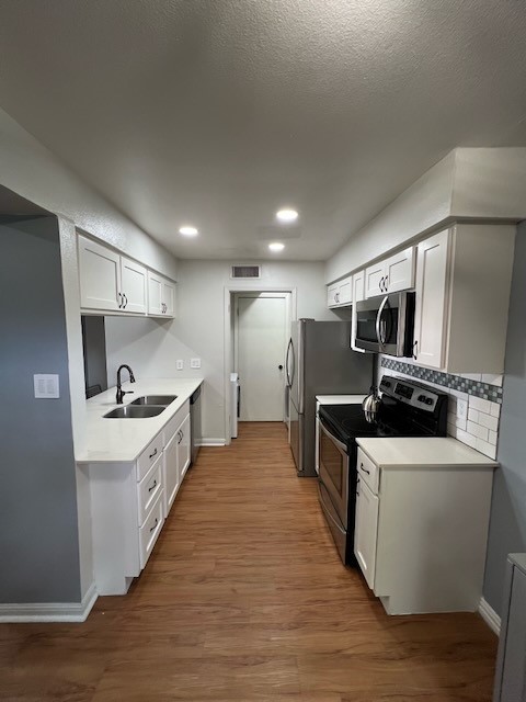 3511 Alpine Circle, Unit 2 Austin, TX 78704 - Photo 5 of 16 a large kitchen with stainless steel appliances a sink and a stove