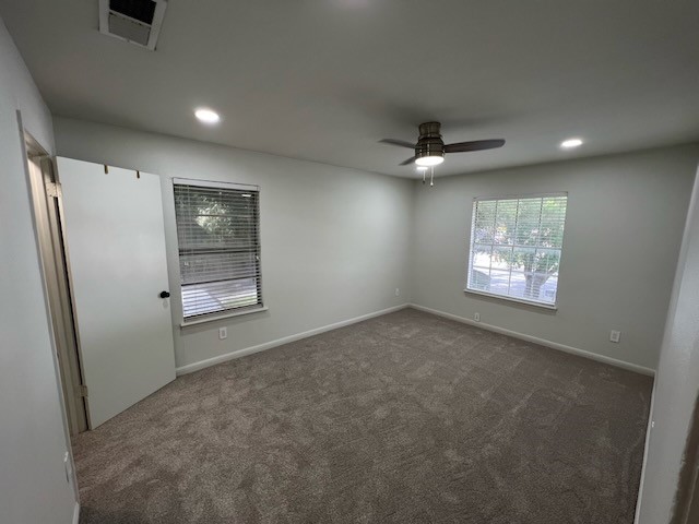 3511 Alpine Circle, Unit 2 Austin, TX 78704 - Photo 9 of 16 an empty room with windows and ceiling fan