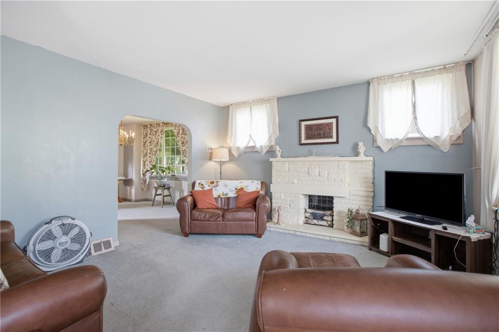 423 Deer Lane Rochester, PA 15074 - Photo 4 of 28 With abundant natural light and the fireplace as your focal point, this encourages you to sit awhile and enjoy friends, a good book or the latest top show